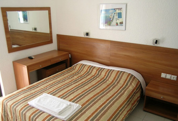 Strewn bed in room